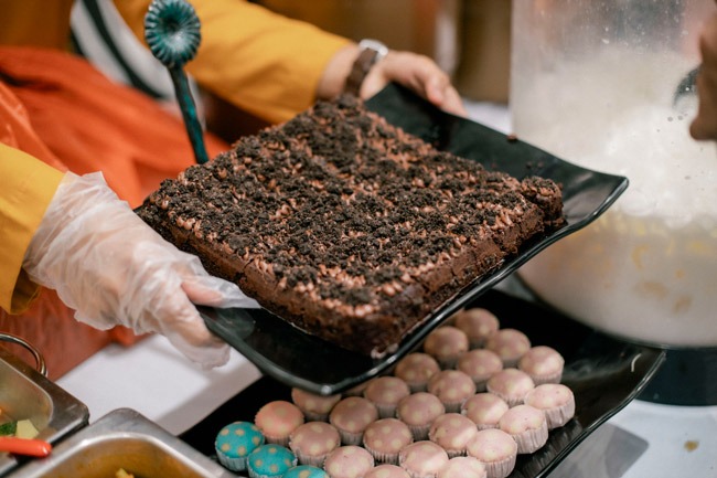 a person holding a rectangular brownie